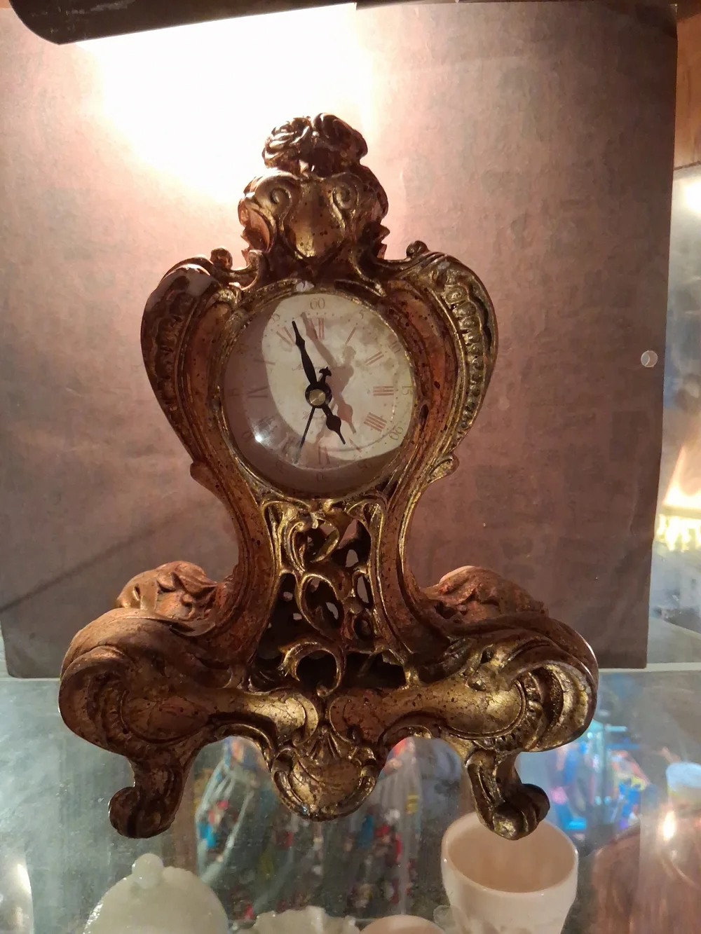 Richard Ward Baroque Style mantel clock, often crafted from cast resin or metal